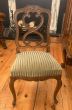 Antique wooden chair with fabric seat