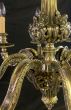 Decorative brass chandelier with cherub detailing 