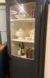 Tall corner cupboard with bow fronted glass 