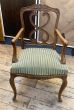 Antique wooden carver chair with fabric seat