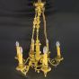 Stylish French gilded brass chandelier, supporting cherubs and 6 candles