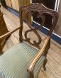 Antique wooden carver chair with fabric seat