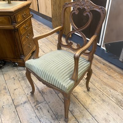 Antique wooden carver chair with fabric seat