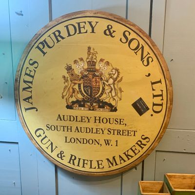 Vintage round wooden Purdey & Sons gun sign