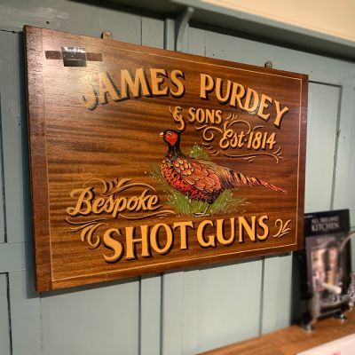 James Purdy shotgun wooden sign 
