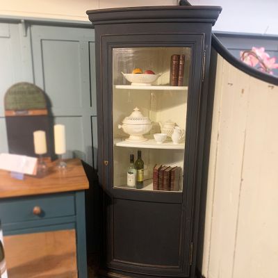 Tall corner cupboard with bow fronted glass 