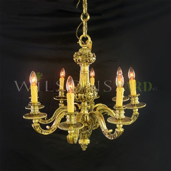 Decorative brass chandelier with cherub detailing 